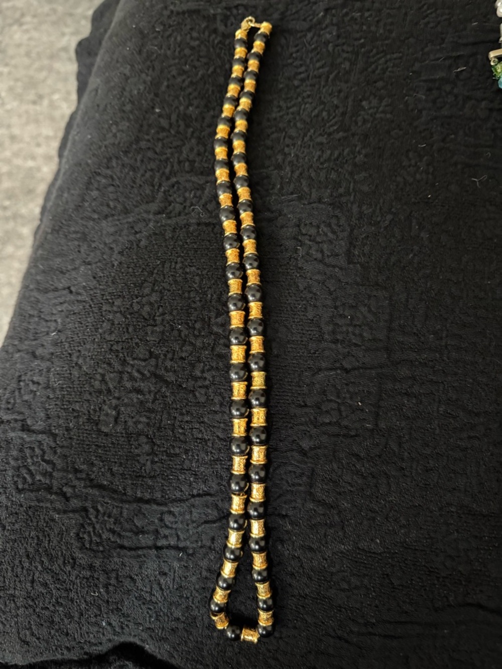 Black beads with gold stations 24”
Necklace